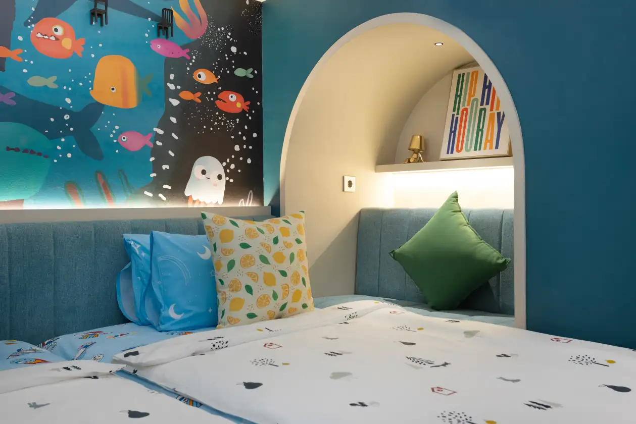 NewAir family duplex room with mural and arched bed nook