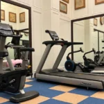 Newair facility gym showing treadmill and exercise bike