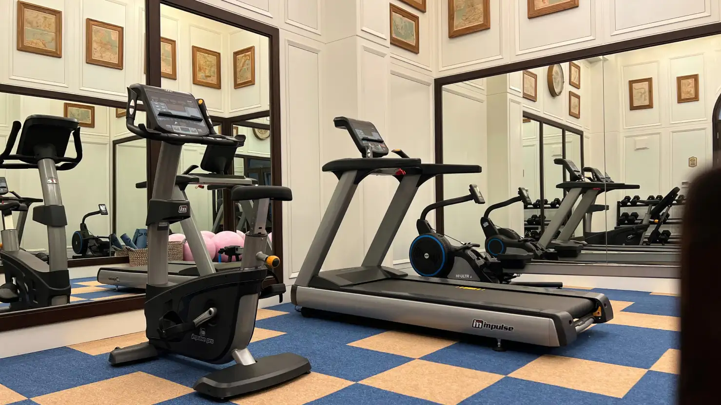Newair facility gym showing treadmill and exercise bike