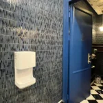 Luxurious newair facility restroom with blue door